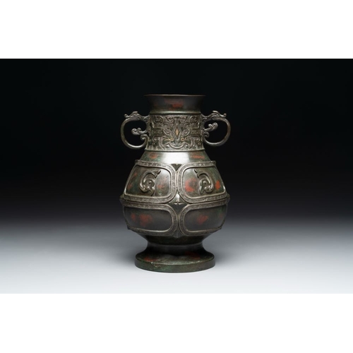 165 - A Chinese archaistic gold- and silver-inlaid bronze vase with pseudo-rust patina, 19th C.H.: 26 cm
 ... 