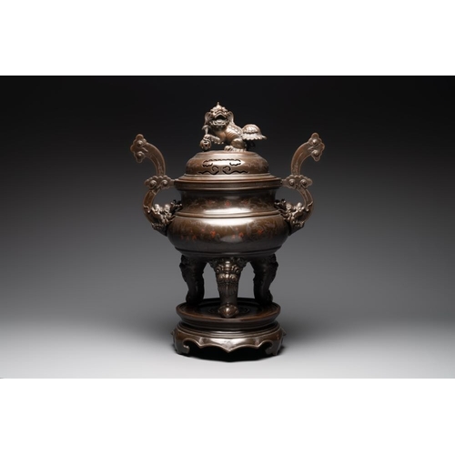 172 - A massive Vietnamese copper- and silver-inlaid 'Buddhist lion' censer and cover on stand, 19th C.L.:... 