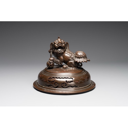 172 - A massive Vietnamese copper- and silver-inlaid 'Buddhist lion' censer and cover on stand, 19th C.L.:... 