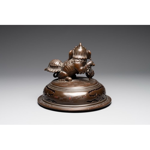 172 - A massive Vietnamese copper- and silver-inlaid 'Buddhist lion' censer and cover on stand, 19th C.L.:... 