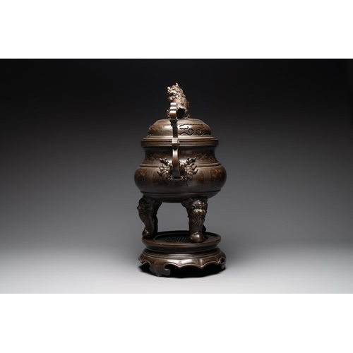 172 - A massive Vietnamese copper- and silver-inlaid 'Buddhist lion' censer and cover on stand, 19th C.L.:... 