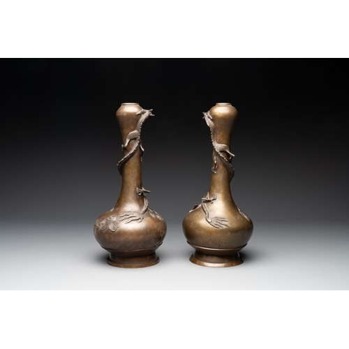 174 - A pair of Chinese or Vietnamese gold-splashed bronze garlic-mouth 'dragon' vases, with seal mark, 17... 