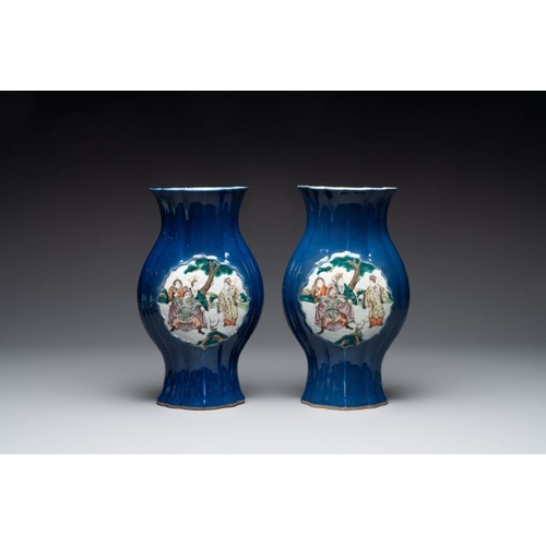 23 - A pair of Chinese famille verte blue-ground lobed vases with figural design, 19th C.H.: 32 cm... 