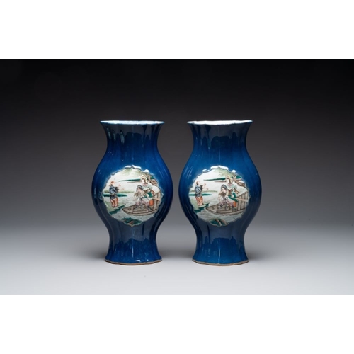 23 - A pair of Chinese famille verte blue-ground lobed vases with figural design, 19th C.H.: 32 cm... 