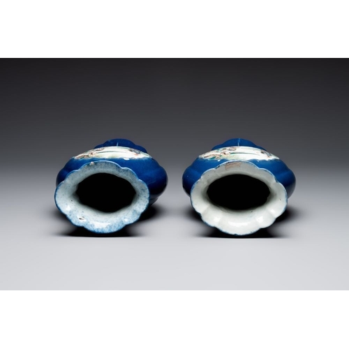 23 - A pair of Chinese famille verte blue-ground lobed vases with figural design, 19th C.H.: 32 cm... 