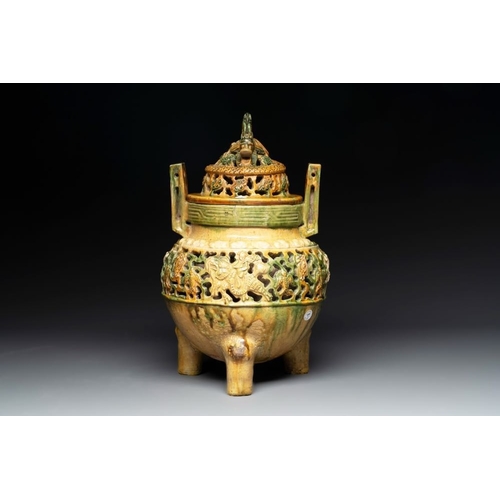 50 - A Chinese sancai-glazed reticulated double-walled tripod censer and cover, MingH.: 35 cm
 Provenance... 