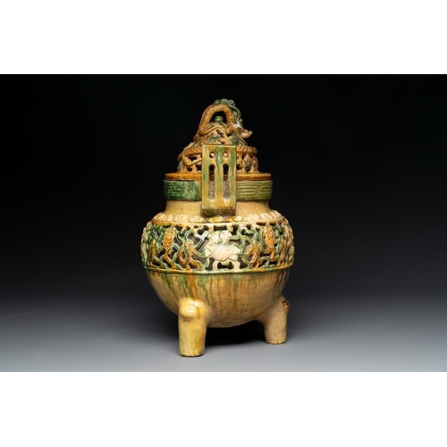 50 - A Chinese sancai-glazed reticulated double-walled tripod censer and cover, MingH.: 35 cm
 Provenance... 