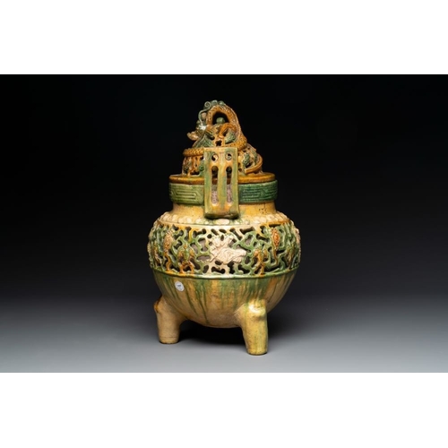 50 - A Chinese sancai-glazed reticulated double-walled tripod censer and cover, MingH.: 35 cm
 Provenance... 