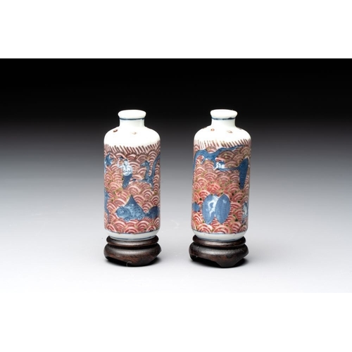 97 - A pair of Chinese blue, white and copper-red 'mythical beasts' and a famille rose 'grasshopper' snuf... 