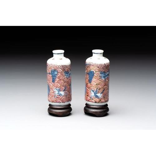 97 - A pair of Chinese blue, white and copper-red 'mythical beasts' and a famille rose 'grasshopper' snuf... 