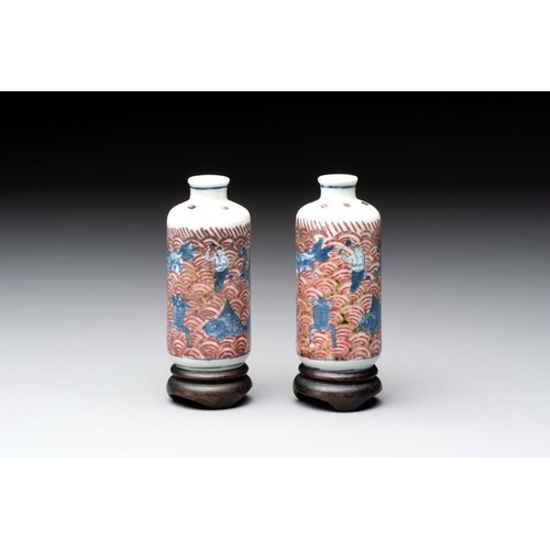 97 - A pair of Chinese blue, white and copper-red 'mythical beasts' and a famille rose 'grasshopper' snuf... 