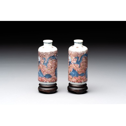 97 - A pair of Chinese blue, white and copper-red 'mythical beasts' and a famille rose 'grasshopper' snuf... 