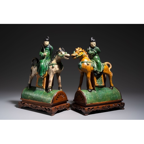 20 - A pair of Chinese sancai-glazed 'Horseriders' roof tiles on wooden stands, MingDim.: 27 x 13 x 38 cm... 
