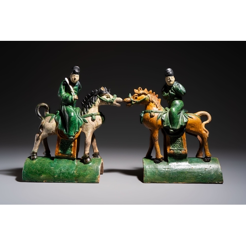 20 - A pair of Chinese sancai-glazed 'Horseriders' roof tiles on wooden stands, MingDim.: 27 x 13 x 38 cm... 