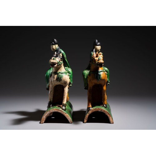 20 - A pair of Chinese sancai-glazed 'Horseriders' roof tiles on wooden stands, MingDim.: 27 x 13 x 38 cm... 