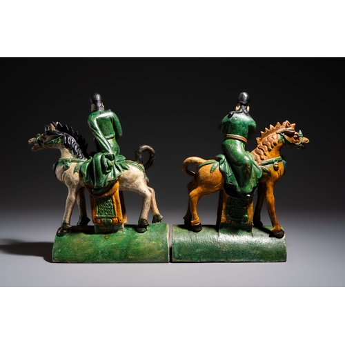 20 - A pair of Chinese sancai-glazed 'Horseriders' roof tiles on wooden stands, MingDim.: 27 x 13 x 38 cm... 