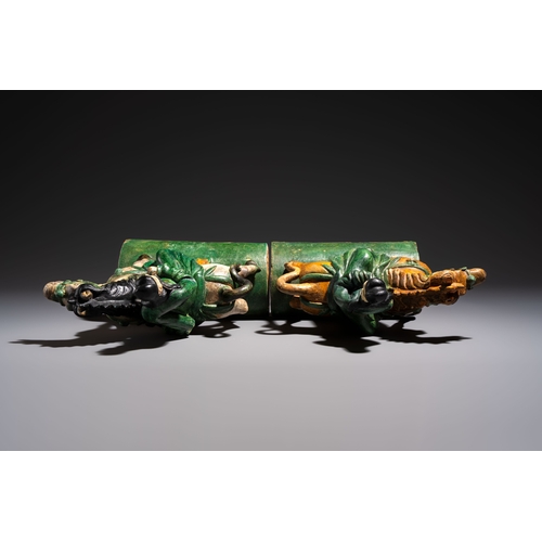 20 - A pair of Chinese sancai-glazed 'Horseriders' roof tiles on wooden stands, MingDim.: 27 x 13 x 38 cm... 