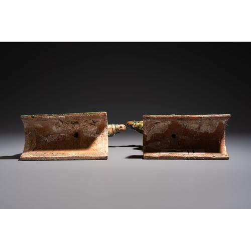 20 - A pair of Chinese sancai-glazed 'Horseriders' roof tiles on wooden stands, MingDim.: 27 x 13 x 38 cm... 