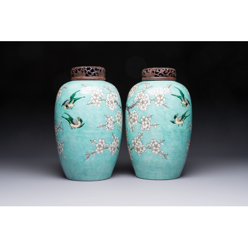 30 - A pair of fine Chinese famille verte turquoise-ground 'Magpie and Prunus' jars with reticulated wood... 