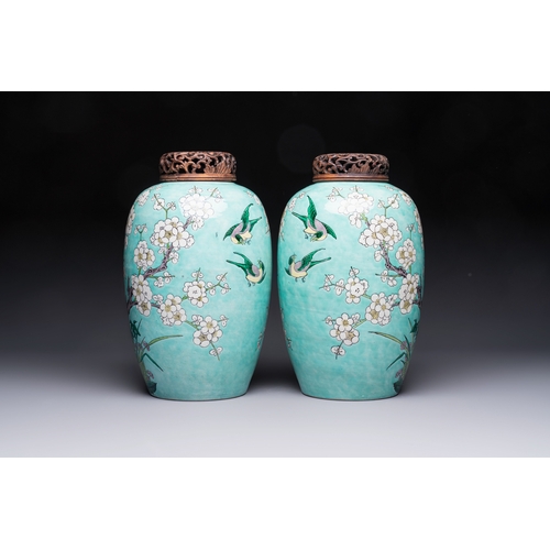 30 - A pair of fine Chinese famille verte turquoise-ground 'Magpie and Prunus' jars with reticulated wood... 