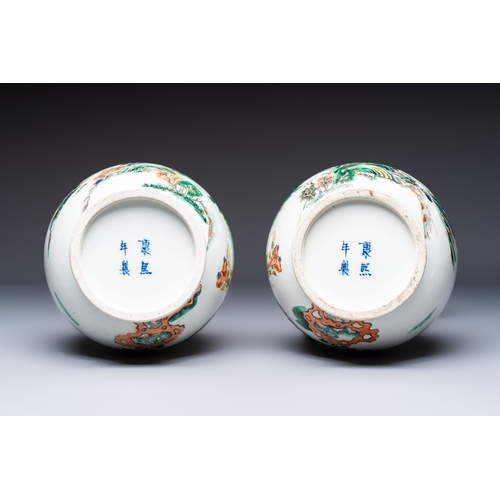 32 - A pair of Chinese famille verte vases with narrative design, 19th C.H.: 35 cmCondition reports and a... 