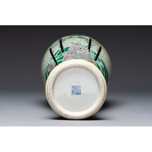 33 - A Chinese verte biscuit 'Dragon Gate Carp' vase on a wooden stand, Xuande mark, 19th C.H.: 63 cm (in... 