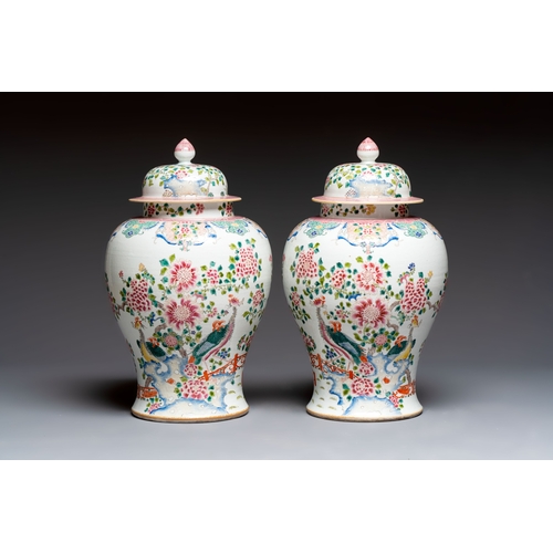 41 - A pair of Chinese famille rose 'Phoenixes among Flowering Branches' vases and covers, 20th C.H.: 52,... 