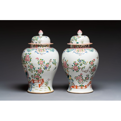 41 - A pair of Chinese famille rose 'Phoenixes among Flowering Branches' vases and covers, 20th C.H.: 52,... 