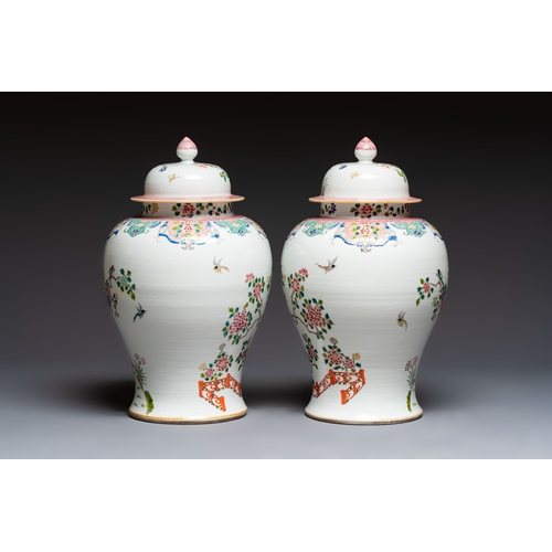 41 - A pair of Chinese famille rose 'Phoenixes among Flowering Branches' vases and covers, 20th C.H.: 52,... 