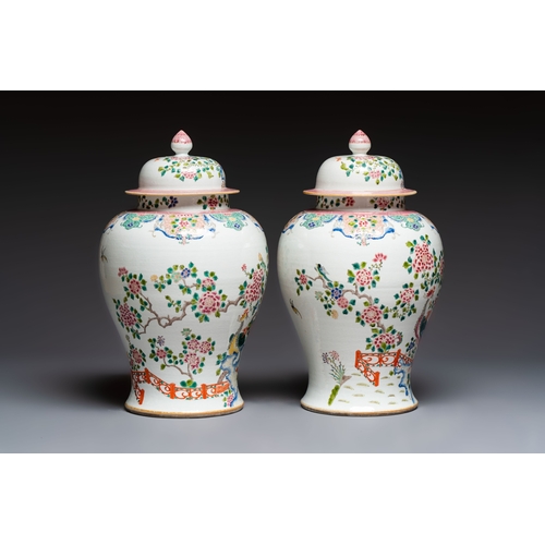 41 - A pair of Chinese famille rose 'Phoenixes among Flowering Branches' vases and covers, 20th C.H.: 52,... 