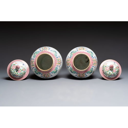 41 - A pair of Chinese famille rose 'Phoenixes among Flowering Branches' vases and covers, 20th C.H.: 52,... 