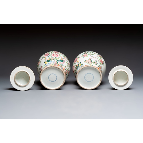 41 - A pair of Chinese famille rose 'Phoenixes among Flowering Branches' vases and covers, 20th C.H.: 52,... 