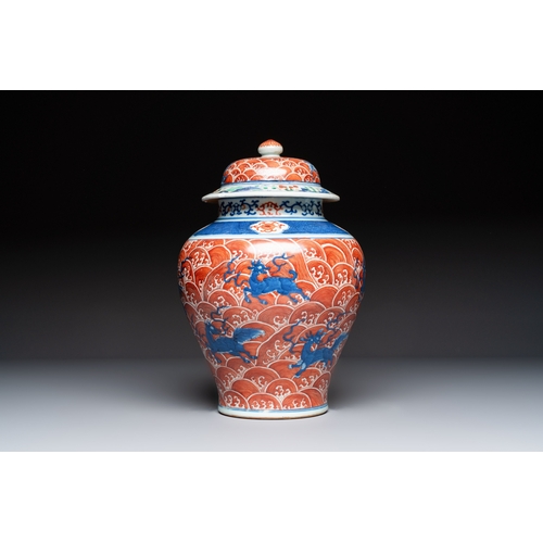 56 - A Chinese blue, white and iron-red decorated 'Mythical Animals' vase and cover, 19th C.H.: 35,5 cm (... 