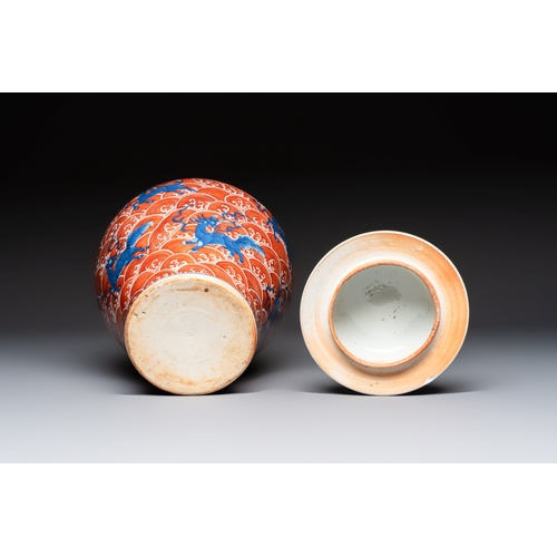 56 - A Chinese blue, white and iron-red decorated 'Mythical Animals' vase and cover, 19th C.H.: 35,5 cm (... 