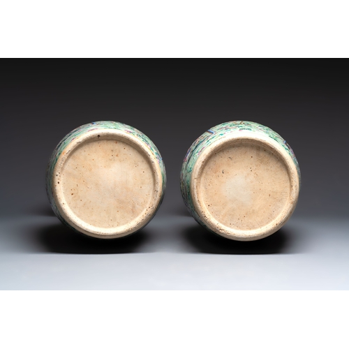 57 - A pair of large Chinese famille rose celadon-ground 'Romance of the Three Kingdoms' vases, 19th C.H.... 