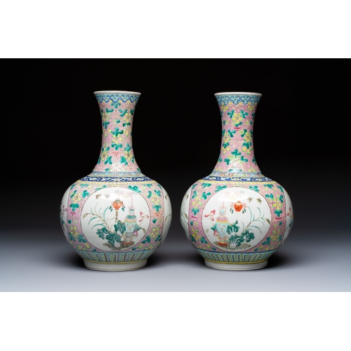 58 - A pair of Chinese famille rose pink-ground 'Ping An Bai Sui' bottle vases, 19th C.H.: 37,5 cmConditi... 