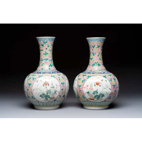 58 - A pair of Chinese famille rose pink-ground 'Ping An Bai Sui' bottle vases, 19th C.H.: 37,5 cmConditi... 
