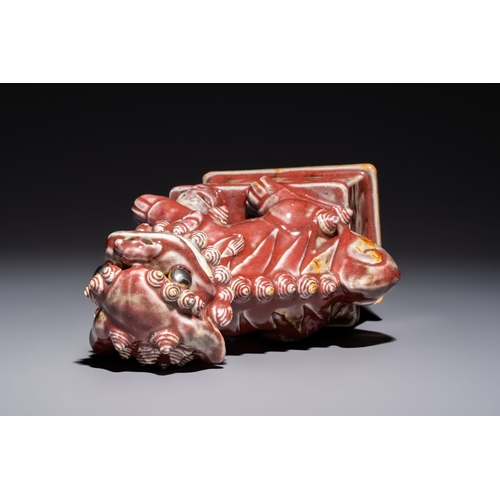 170 - A Chinese copper-red-glazed Buddhist lion, 19th C.H.: 27,5 cm
Condition reports and additional high-... 