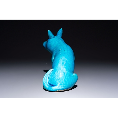194 - A Chinese turquoise-glazed model of a dog, Qianlong mark, 19th C.L.: 19 cm - H.: 16 cm 
Condition re... 