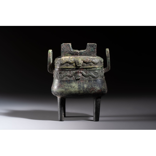244 - An inscribed Chinese archaic bronze food vessel and cover with double-dragon design, 'Yu Fang Ding',... 