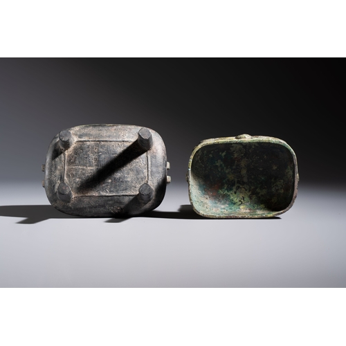 244 - An inscribed Chinese archaic bronze food vessel and cover with double-dragon design, 'Yu Fang Ding',... 