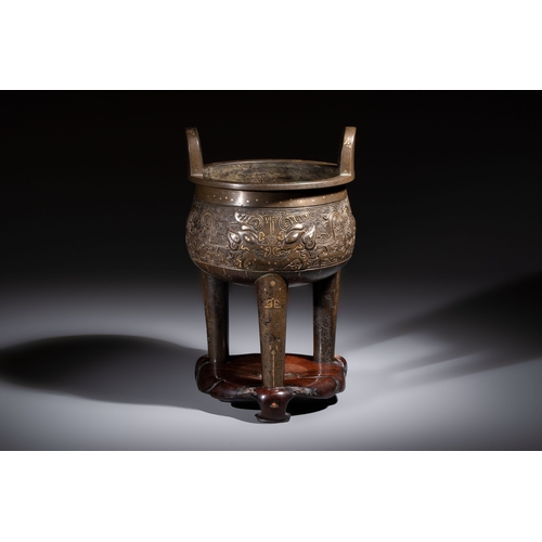 249 - A rare Chinese gold- and silver-inlaid bronze 'Ding' censer with Taotie design on a hongmu stand, Sh... 