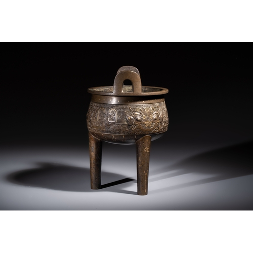 249 - A rare Chinese gold- and silver-inlaid bronze 'Ding' censer with Taotie design on a hongmu stand, Sh... 