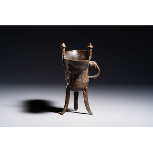 253 - A Chinese archaistic bronze ritual wine vessel, Jue, Qianlong mark, dated 1738L.: 17,5 cm - H.: 16,5... 