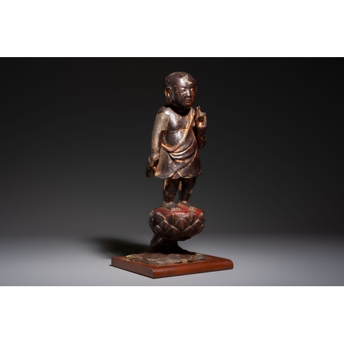 257 - A rare Chinese gilt-lacquered bronze Buddha standing on a lotus throne, MingH.: 46 cm (incl. stand)H... 