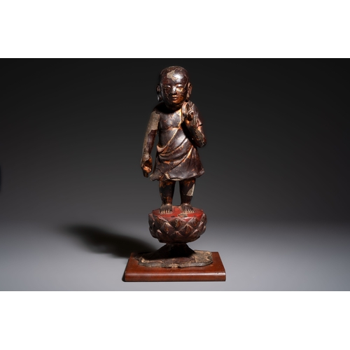 257 - A rare Chinese gilt-lacquered bronze Buddha standing on a lotus throne, MingH.: 46 cm (incl. stand)H... 