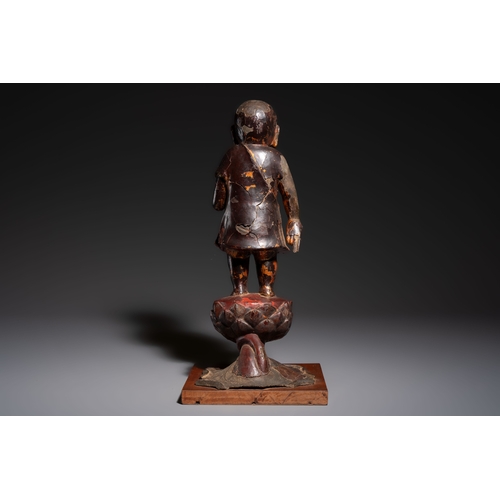 257 - A rare Chinese gilt-lacquered bronze Buddha standing on a lotus throne, MingH.: 46 cm (incl. stand)H... 
