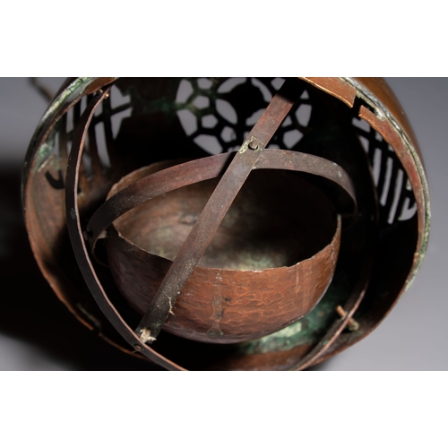 280 - A Chinese or Vietnamese silver-inlaid copper reticulated spherical censer and a silver- and copper-i... 