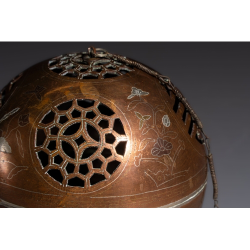 280 - A Chinese or Vietnamese silver-inlaid copper reticulated spherical censer and a silver- and copper-i... 
