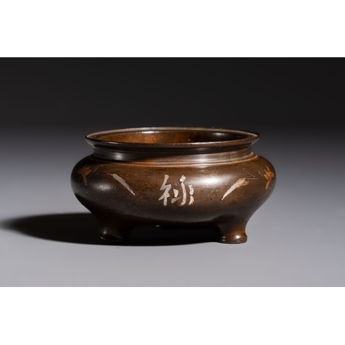 280 - A Chinese or Vietnamese silver-inlaid copper reticulated spherical censer and a silver- and copper-i... 